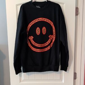 Dressed in LALA Black Crewneck with Red Leopard Smiley Graphic